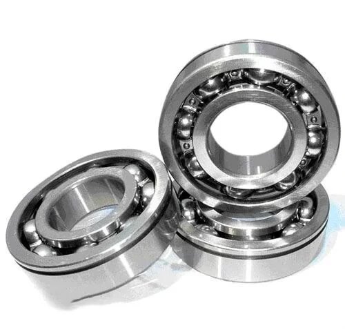 How do self-aligning ball bearings reduce stress in misaligned shaft applications?